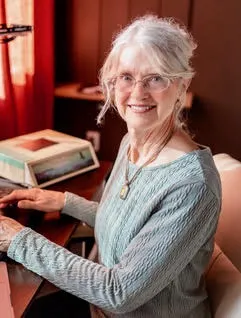 Cynthia Maguire at desk